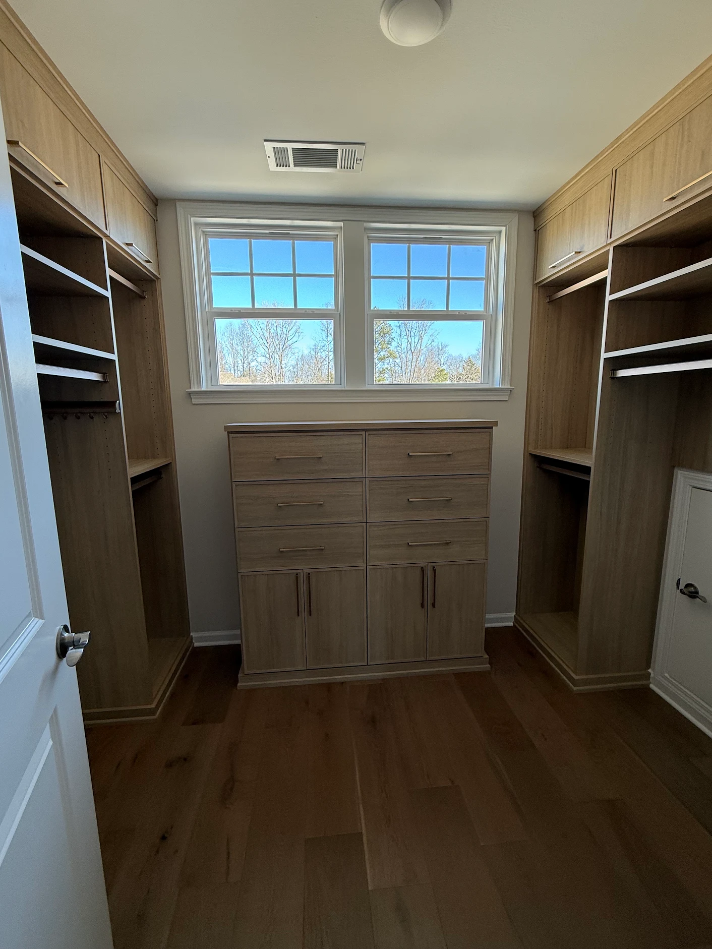 Natural wood custom walk-in closet