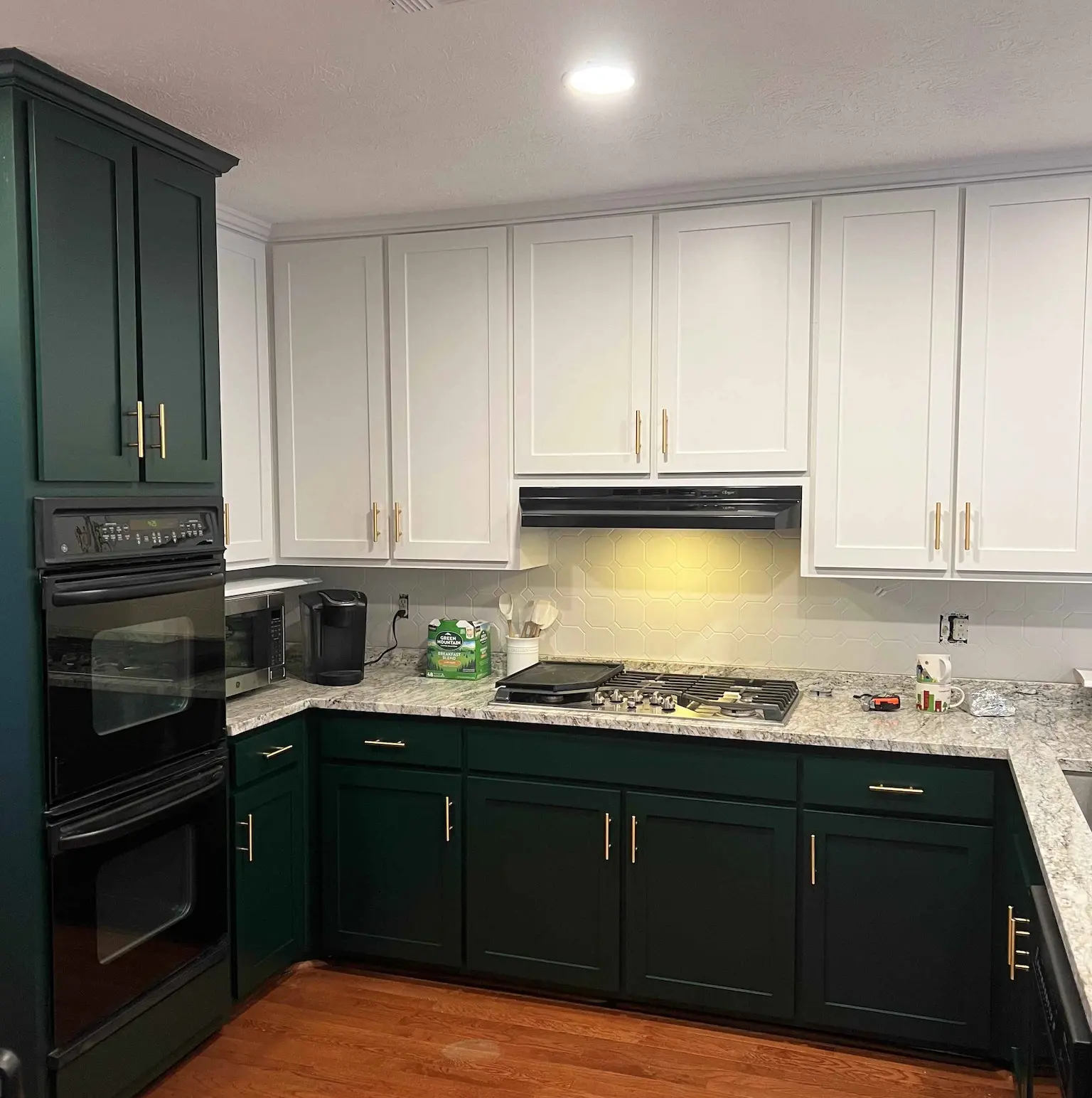 Green and white kitchen cabinetry