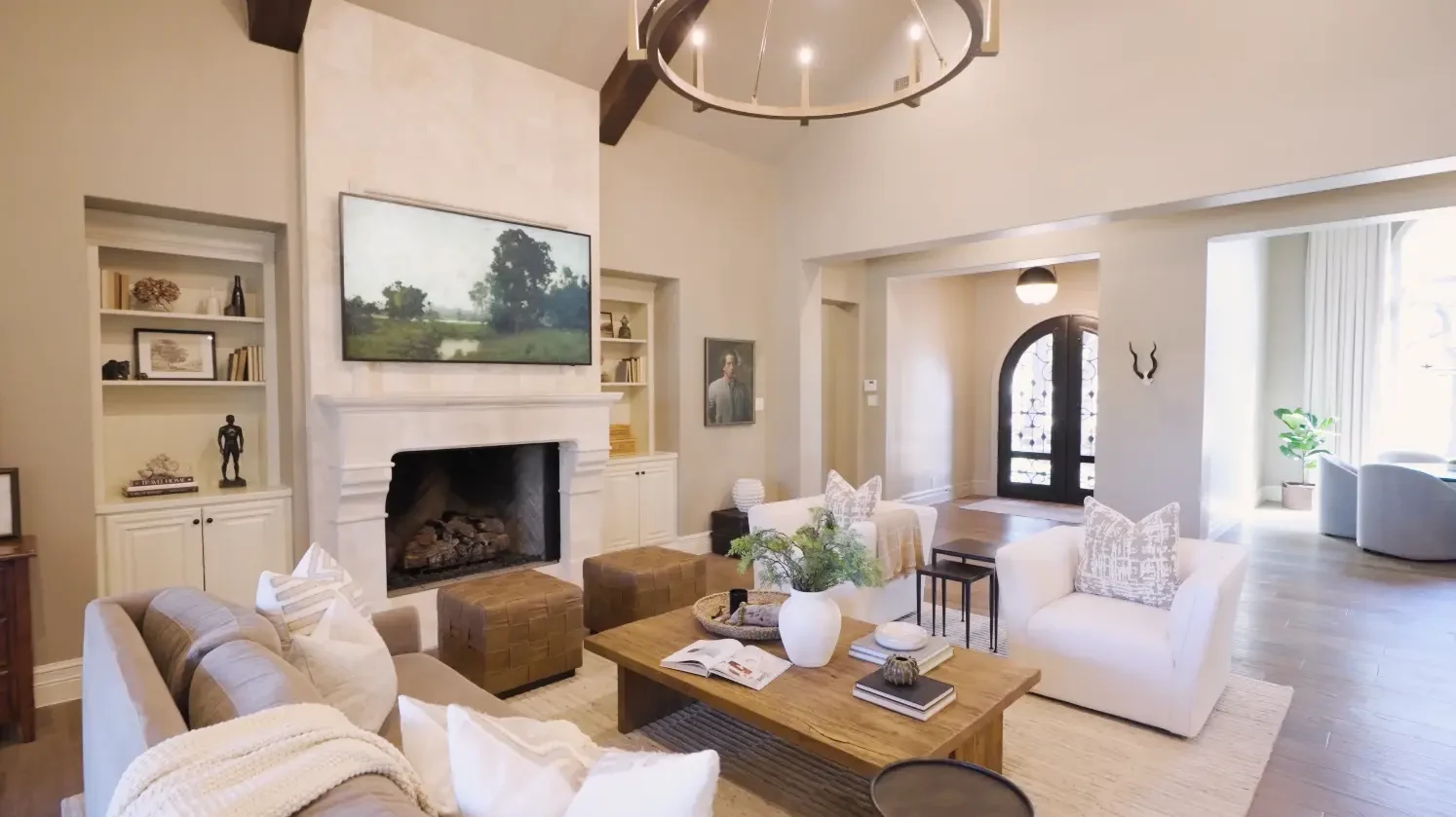 Formal living room with clean painted walls, trim and built-ins