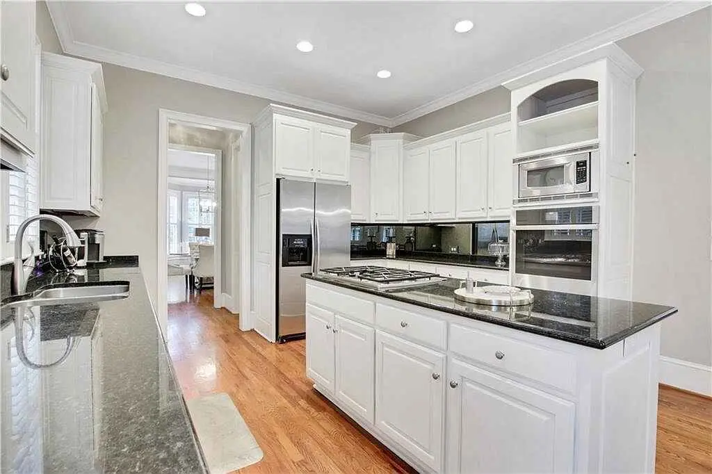 Completed white kitchen with custom cabinetry and island